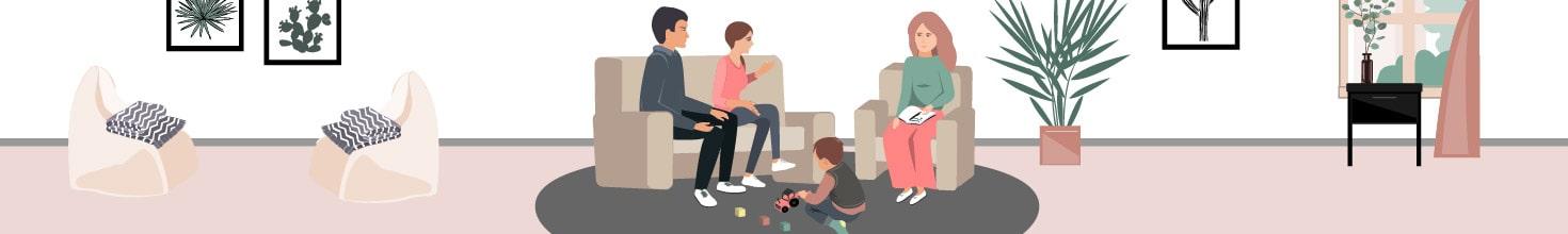 parents_talking_to_therapist_while_little_boy_plays_with_toys