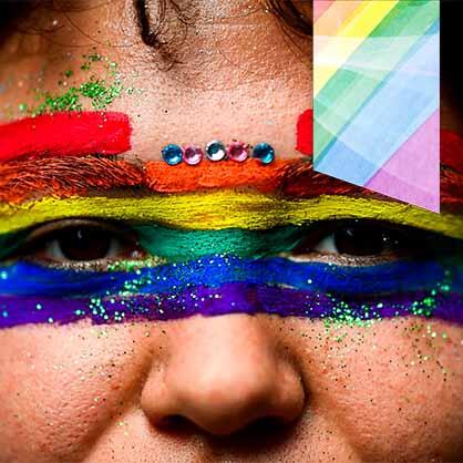 Face painted in rainbow colors to represent pride